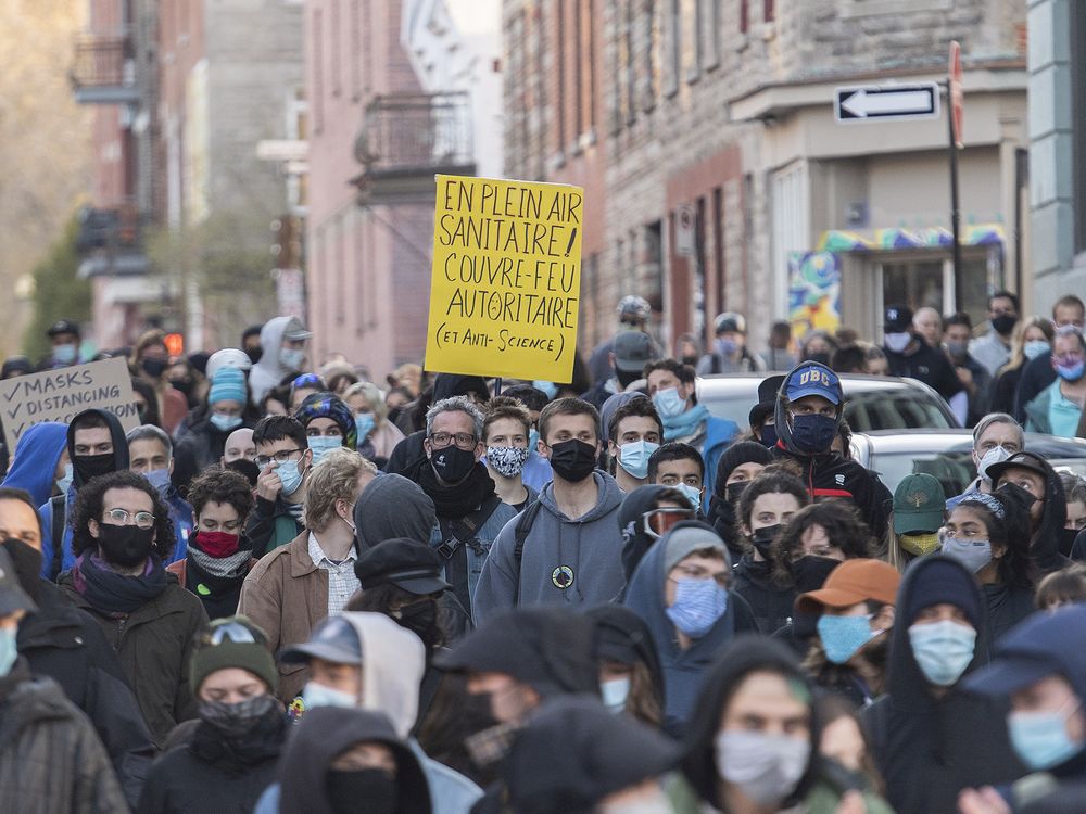 People take part in a demonstration opposing the Quebec government's 8 p.m. curfew in Montreal, Sunday, April 18, 2021.