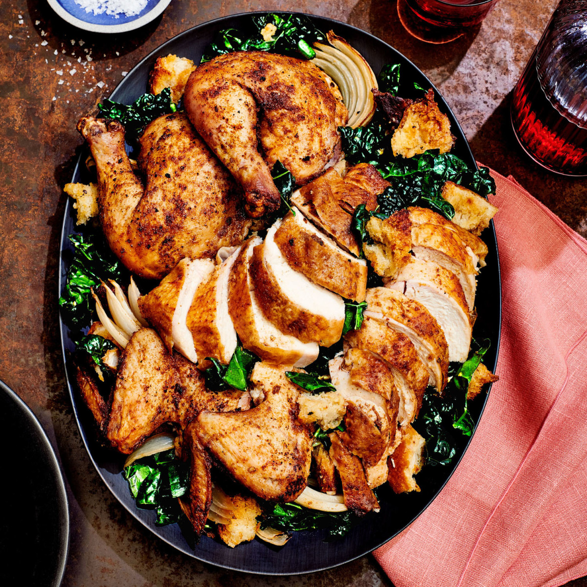 spice-rubbed butterflied roast chicken with kale salad and crunchy croutons