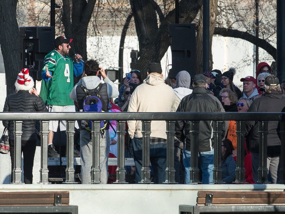 Anti-vaccine/anti-mask demonstrators are seen gathered at the cenotaph in Victoria Park in Regina, Saskatchewan on April 24, 2021. Speaker 