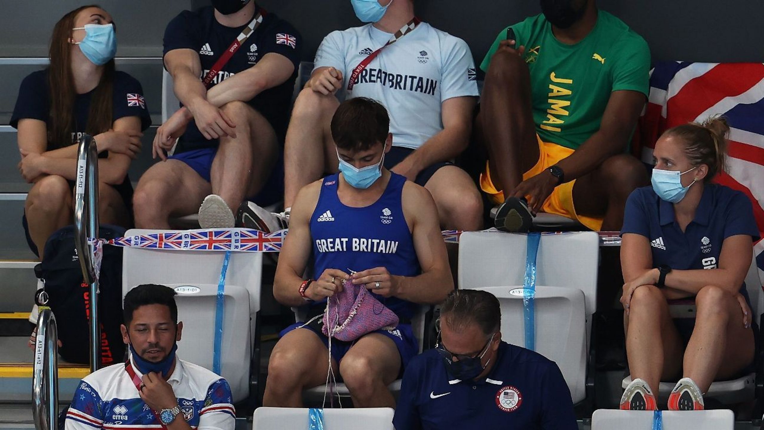 Great Britain diver Tom Daley knits while in stands at Tokyo Olympics