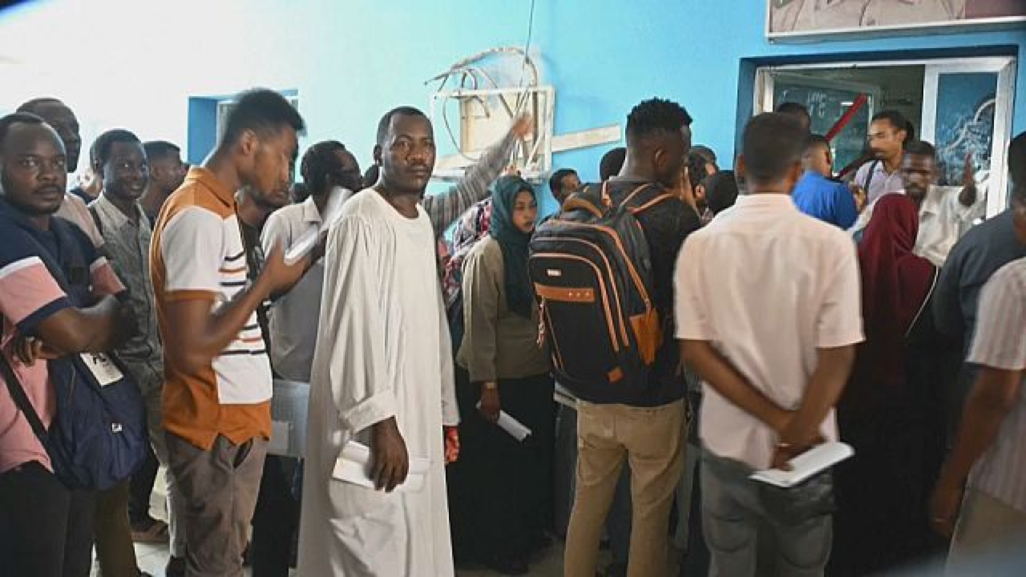 Desperate Sudanese face endless wait for passports so they can flee the war Desperate Sudanese face endless wait for passports so they can flee the war
