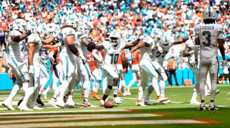 Dolphins drop 70 points on Broncos in record day