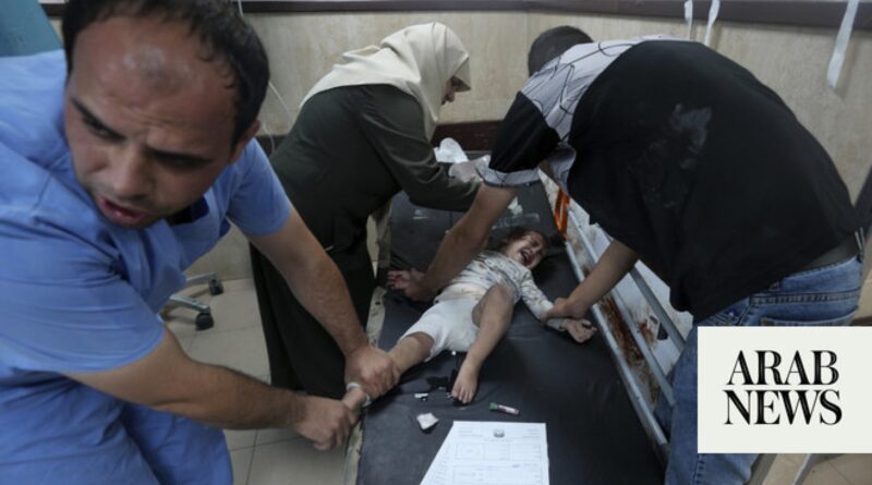 Bodies line Gaza hospital wall and surgeons operate in corridors