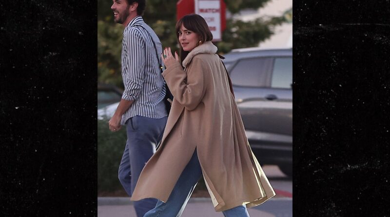 Dakota Johnson Flaunts Engagement Ring After False Report of Chris Martin Split