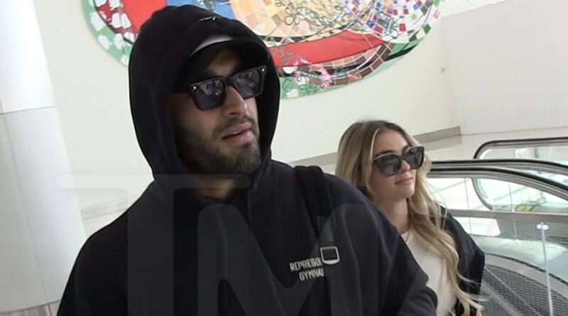 Sam Asghari Filmed With Britney Look-Alike Girlfriend at LAX Airport