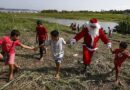 Father Christmas delivers gifts to Brazilian Amazon communities