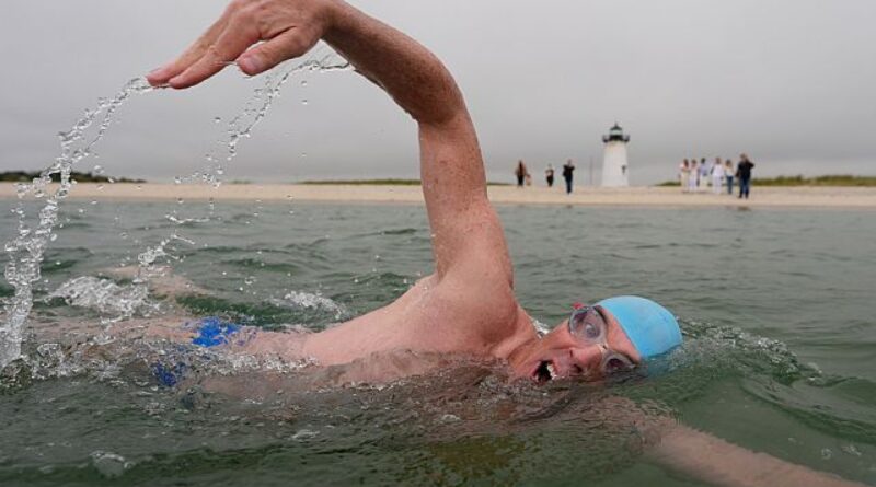 Endurance athlete begins swim in shark-infested waters
